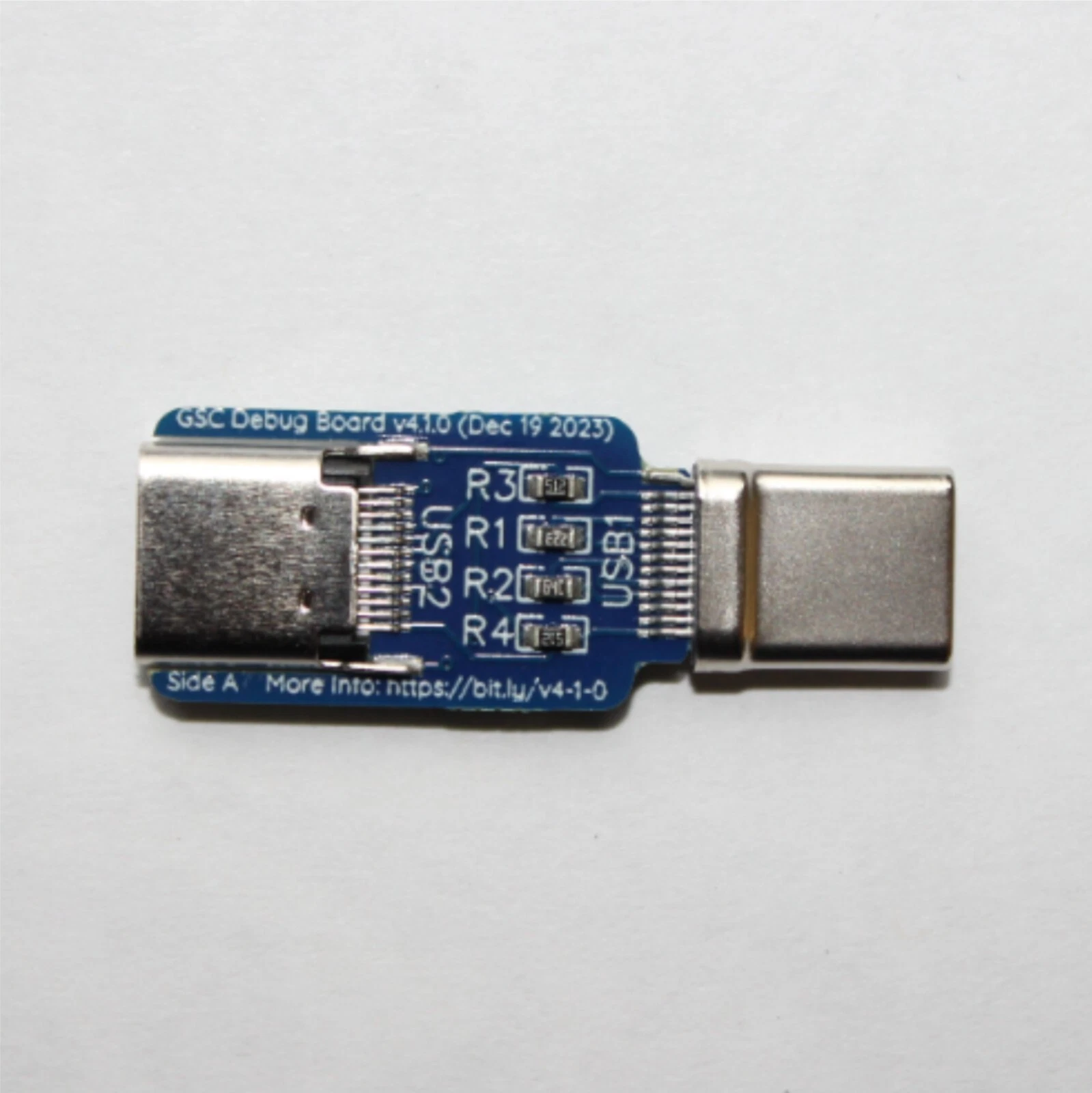 ChocolateLoverRaj GSC Debug Board v4.1.0 — USB-C on the left (puck-side), USB-A on the right (Mac-side), four bias resistors on the CC lines in the middle.