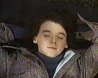 Harold from Harold and Maude, eyes closed, in tweed